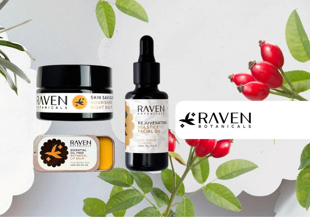 3 Raven Botanicals products surrounded by plants. The Raven Botanicals logo is also featured in the bottom right corner of the photo.